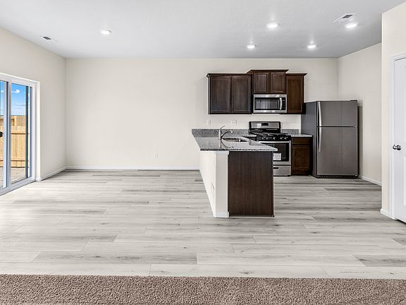 A quaint dining area looks out into the backyard.