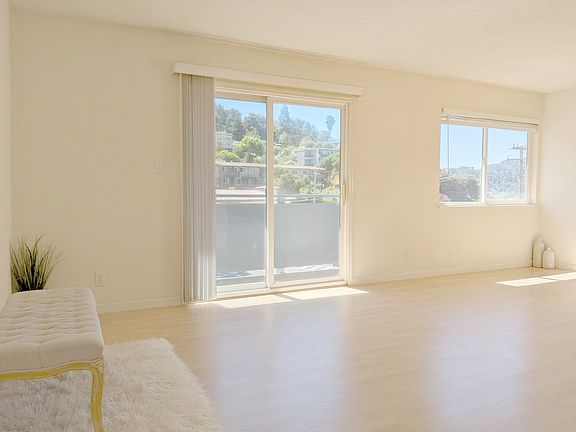 Southern exposure. Sliding glass door to balcony.