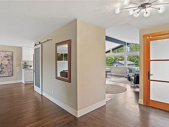 Walk into a completely remodeled home done in 2020. Frosted 3-panel front door for privacy and updated pendant lighting for a modern touch.