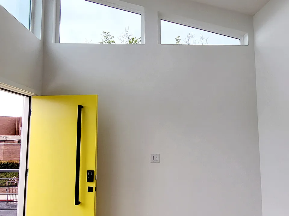 Vaulted ceilings. Fan in living room.