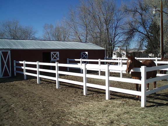 New vinyl fencing around stable area