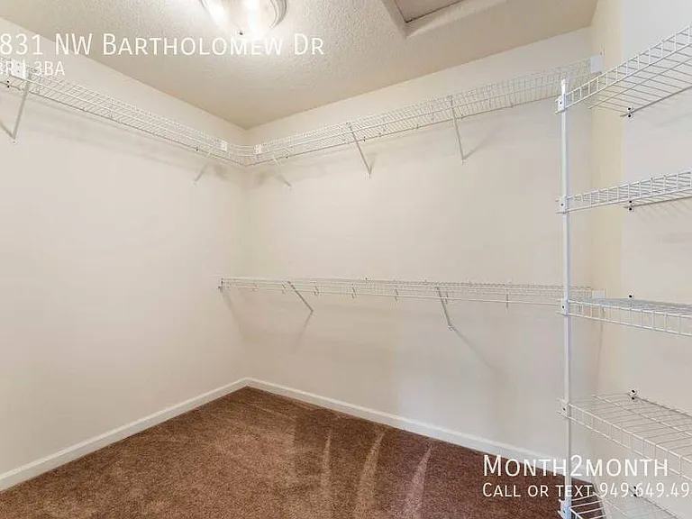 9831 NW Bartholomew Dr — Photo 26