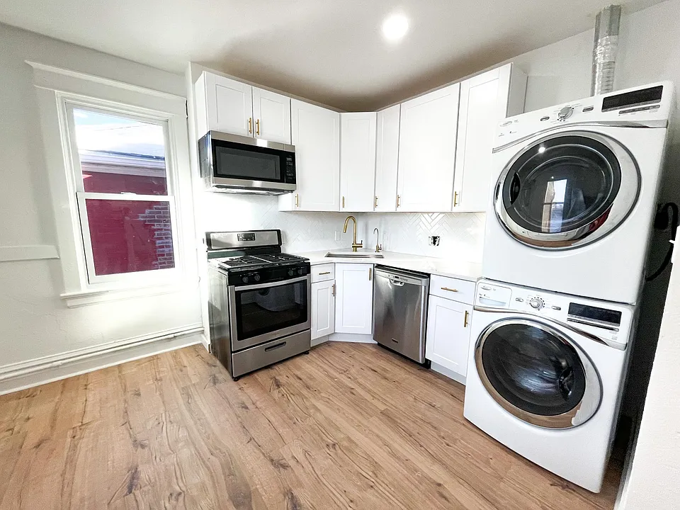 Kitchen with an access to a small back porch