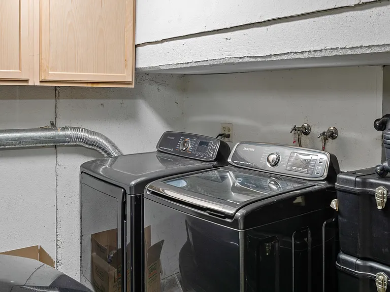 Tucked away in a discreet corner, the washer and dryer await guests with open arms, offering a convenient solution for your laundry needs during your stay.