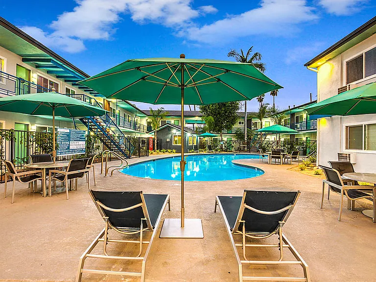 The Island Apartments pool area and lounge chairs