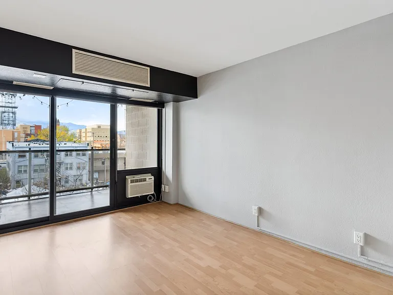 Bedroom 2 with balcony and walk-in closet.