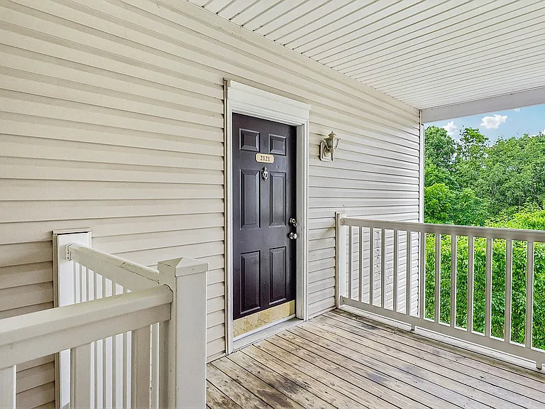 Inviting apartment entrance with elegant black door