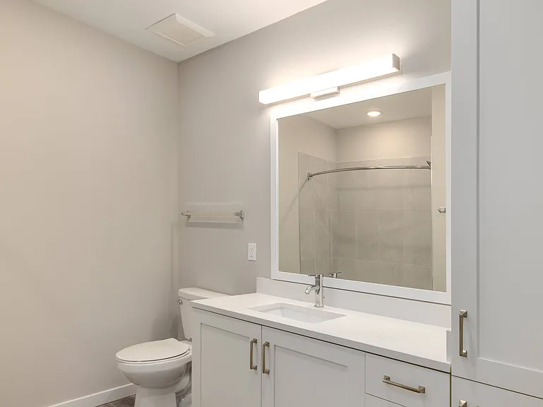 Imperial Crossing Luxury Apartment Homes unit showing a bathroom with sink and storage cabinet.