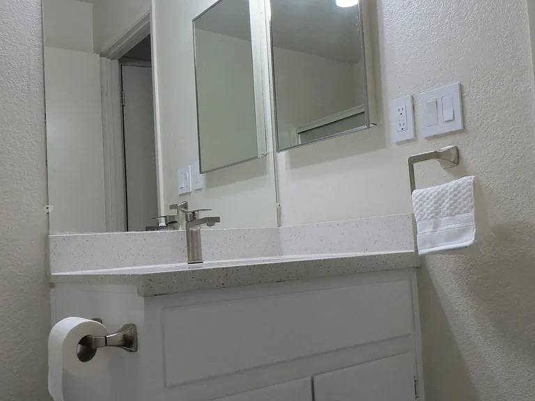 Bathroom (different angle) all new lights, new faucet, new q