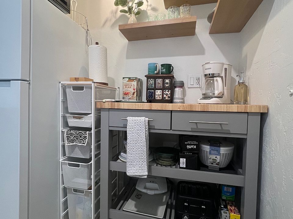 Kitchenette with hot plate, microwave, fridge, dishes, coffee maker, grinder, Keurig, hot water kettle, air fryer, griddle, popcorn maker, salad spinner, rice cooker, toaster, toaster oven