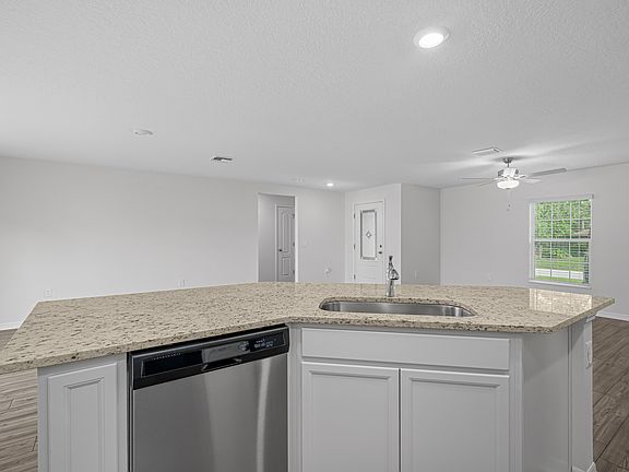 The kitchen has a large island that will be perfect for you and your family to gather around