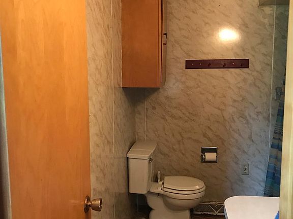 Main floor bathroom has tub/shower with new tub surround.