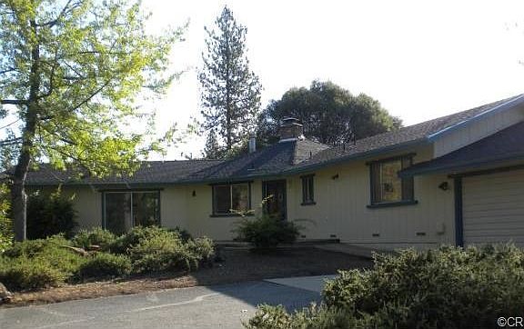 Front shot of this custom built California ranch style home.
