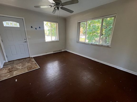 Entrance into the unit. Big windows, tile entry. FLOOR WILL BE PAINTED BLACK LIKE THE MASTER BEDROOM PICTURE.