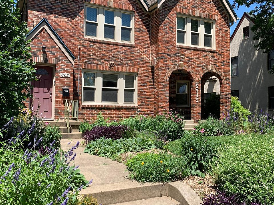 Beautiful landscaping with 5919 front entrance on right