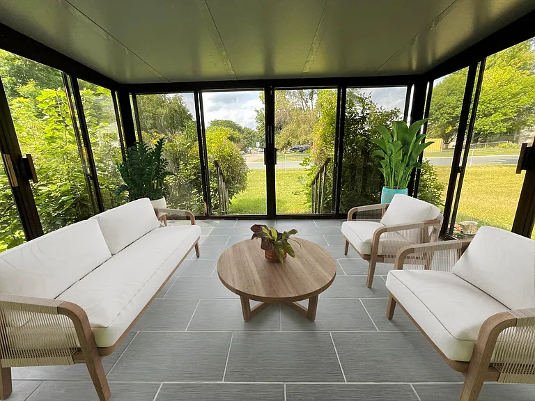 3-season patio with tiled floors. Makes the perfect mosquito-protected area where you can slide the doors open and enjoy the outdoor weather.