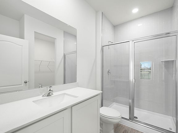 The master bathroom has a large walk in shower