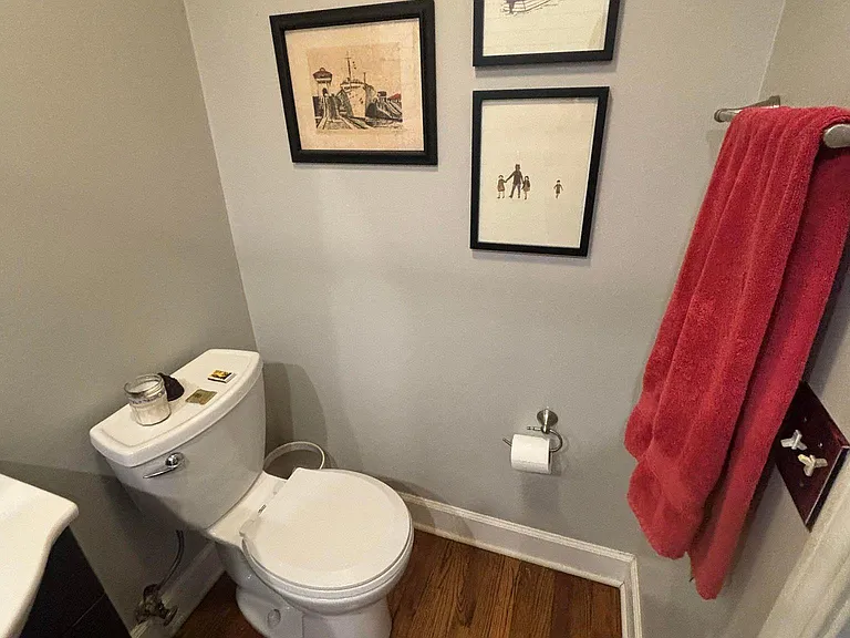 Full bathroom in middle of house with glass enclosed showers
