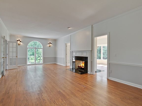 Living room with 2-sided fireplace shared with office