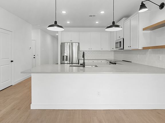 Kitchen with floating shelves