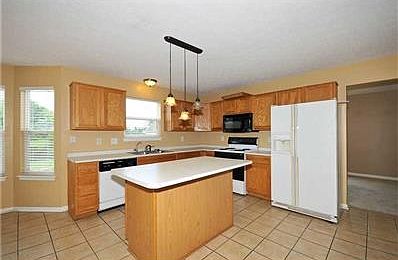 Kitchen. New tile flooring, all appliances stay, updated fixtures, large pantry. Enjoy cooking in th