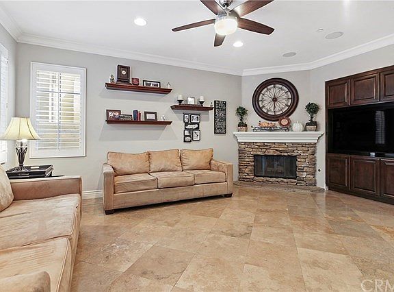 Family room includes custom built-ins. Notice fireplace mantle and hearth for decorating!