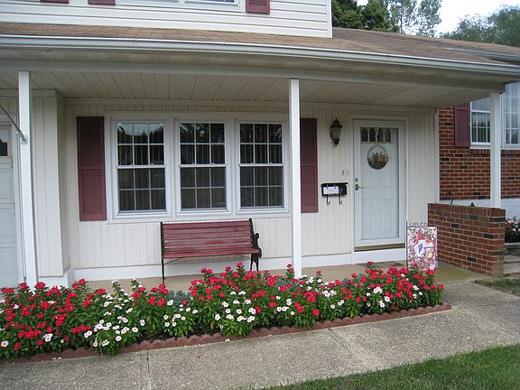Attractive, covered entry with lots of color