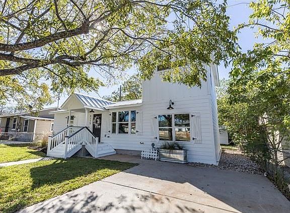 East Austin original with new Hardie siding and standing seam metal roof.