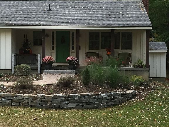 New landscaping & stone wall