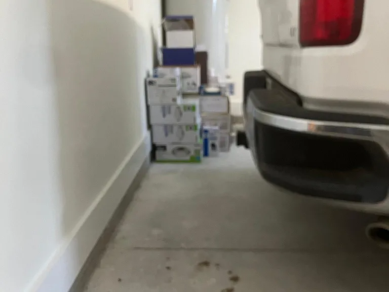 Photo here to show the capacity of the garage. 22 foot deep garage. 4 door Silverado in picture fully in garage with 2 feet to spare.