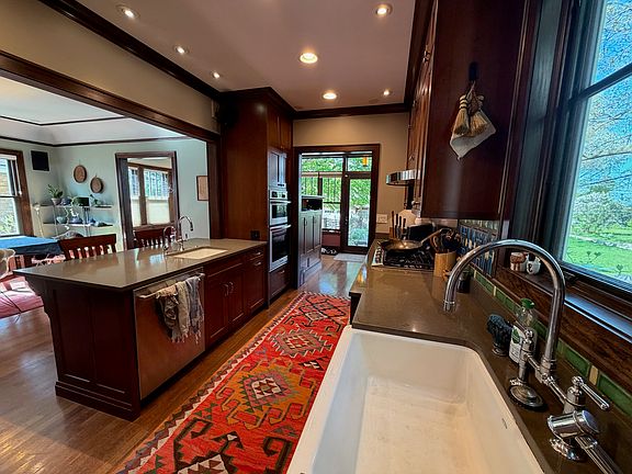 Open-concept Kitchen plus island and double Kohler sinks
