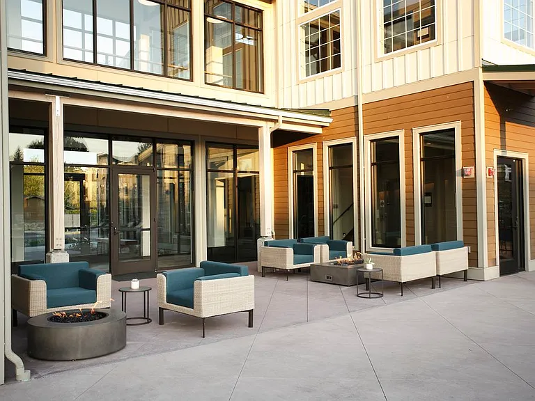 Outdoor lounge with fireplace and lounge seating