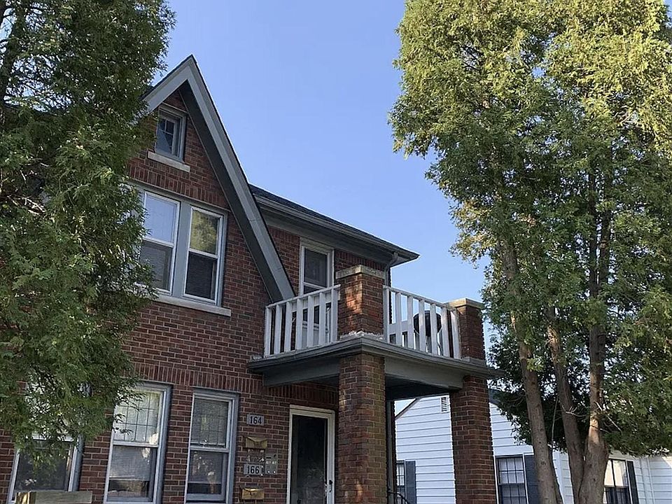 Front of house, shared entrance, and private upper balcony