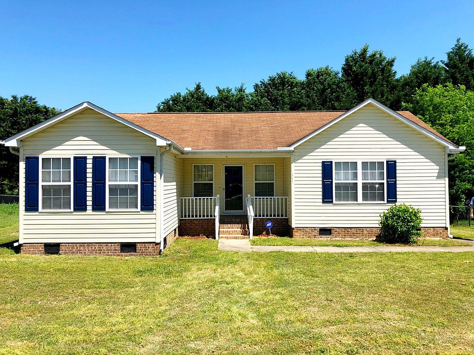 3 bed, 2 bath with a front porch, deck, and fenced in yard