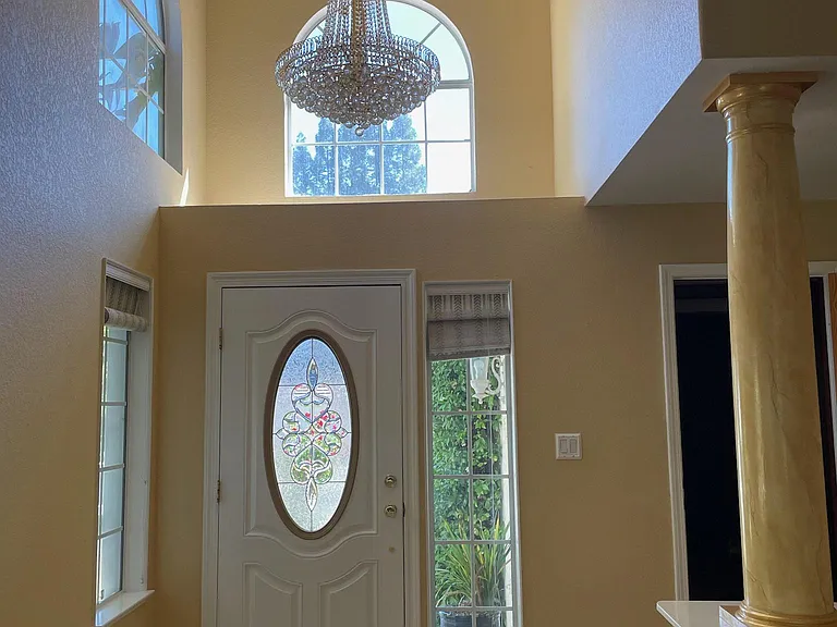 Entrance with majestic chandler