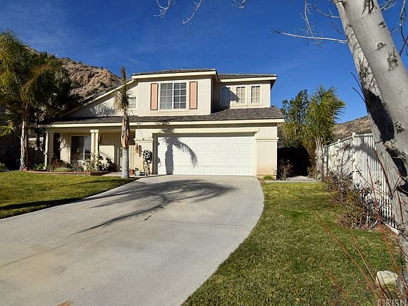 Nice long driveway with room to park PLUS a 2 car