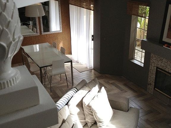 View of 2-story living room from staircase landing