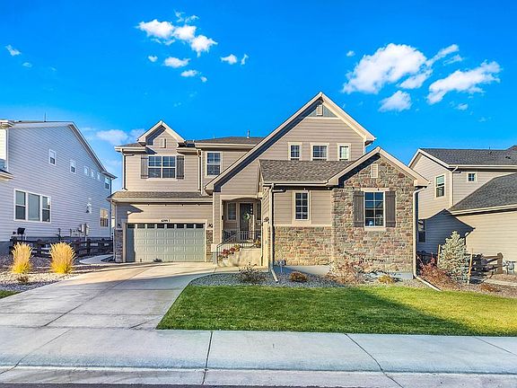 Front of home with large driveway
