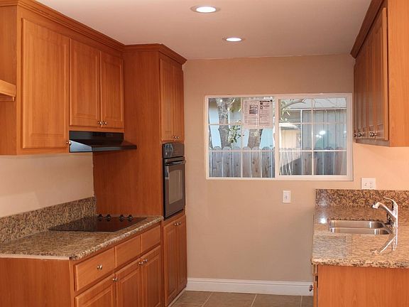 LED lights in kitchen, granite counter tops, and a window to side yard for natural lighting.