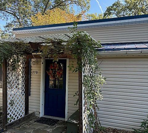 Wisteria trellis
Front door