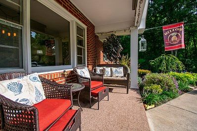 Lush Flower Beds; nice front Porch
