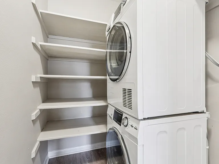 Convenient Laundry combined in walk in closet.
