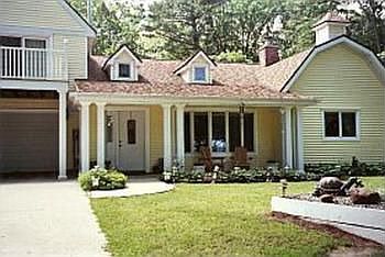 A close-up of the covered front porch area facing Lake Huron.