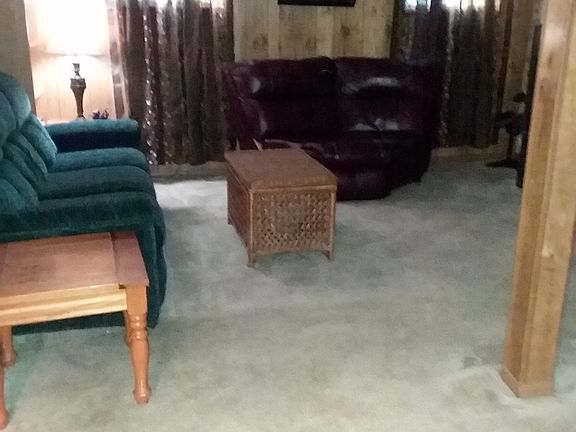 One side of downstairs den