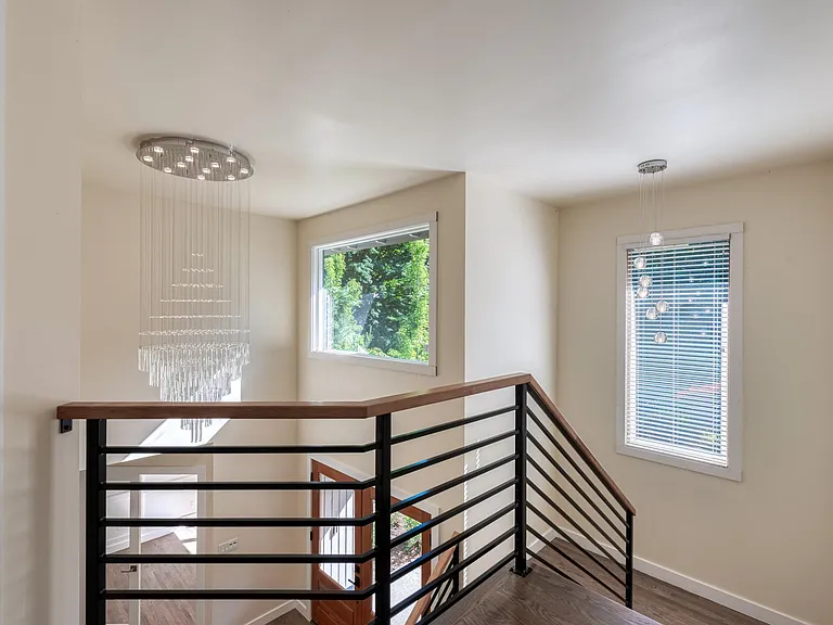 Stunning Staircase and chandelier to greet and wow your guests