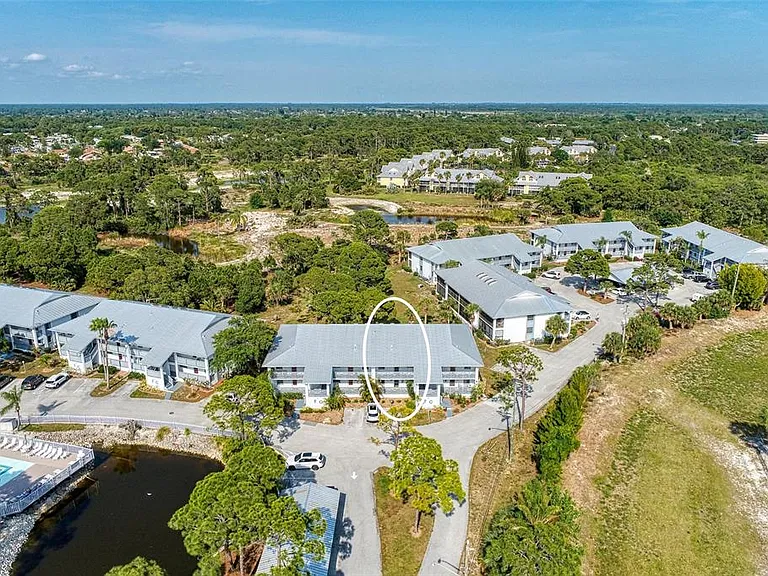 Location is everything. __ Our bird's-eye view highlights the quiet, safe community atmosphere we love. Whether you're here for the golf, the preserve trails, or the nearby beaches, Unit 1003 is the ultimate home base. __