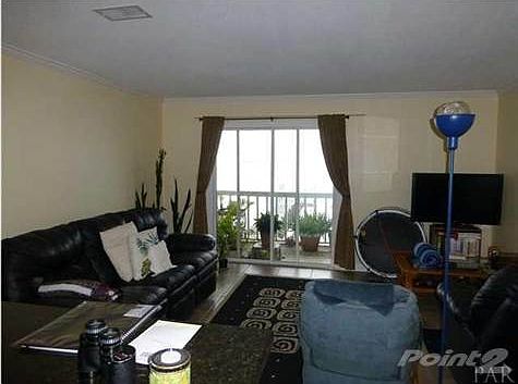Living area looking out at deck and beautiful view of PENSACOLA SOUND