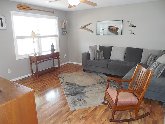 Living Room. New Windows Throughout, New Roof, AC, Furnace and Ceiling Fans in All Rooms in 2013. New Hot Water Heater 2014.New Storm Doors, New Carpet 2018, Just Move In and Enjoy.