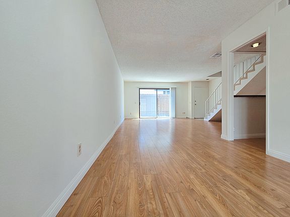 Living Room w/ Bar Area and Dining Area