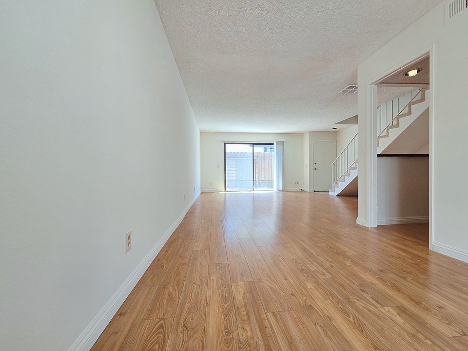 Living Room w/ Bar Area and Dining Area